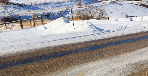 snow plowed onto roadway.jpg